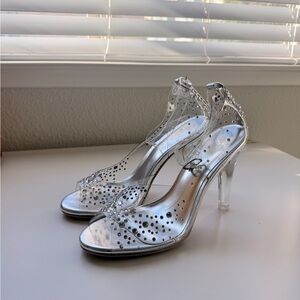 Size 7M Fabulicious clear high heels with rhinestone details.